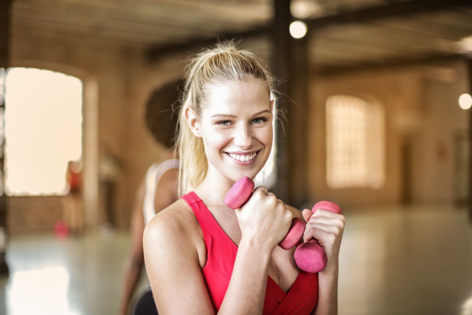Woman smiling during workout at the gym